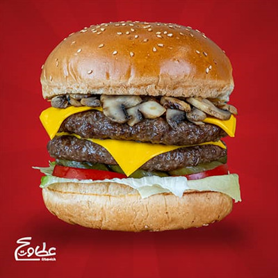 2 عدد برگر 160 گرمی ، پنیر گودا ،کاهو ، گوجه ، خیارشور ، قارچ و نان گرد رومال دار کنجدی دابل چیز برگر